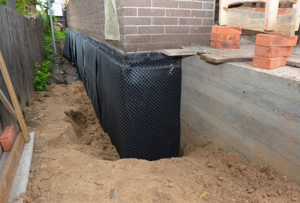 Happy homeowners after waterproofing job in Neville
